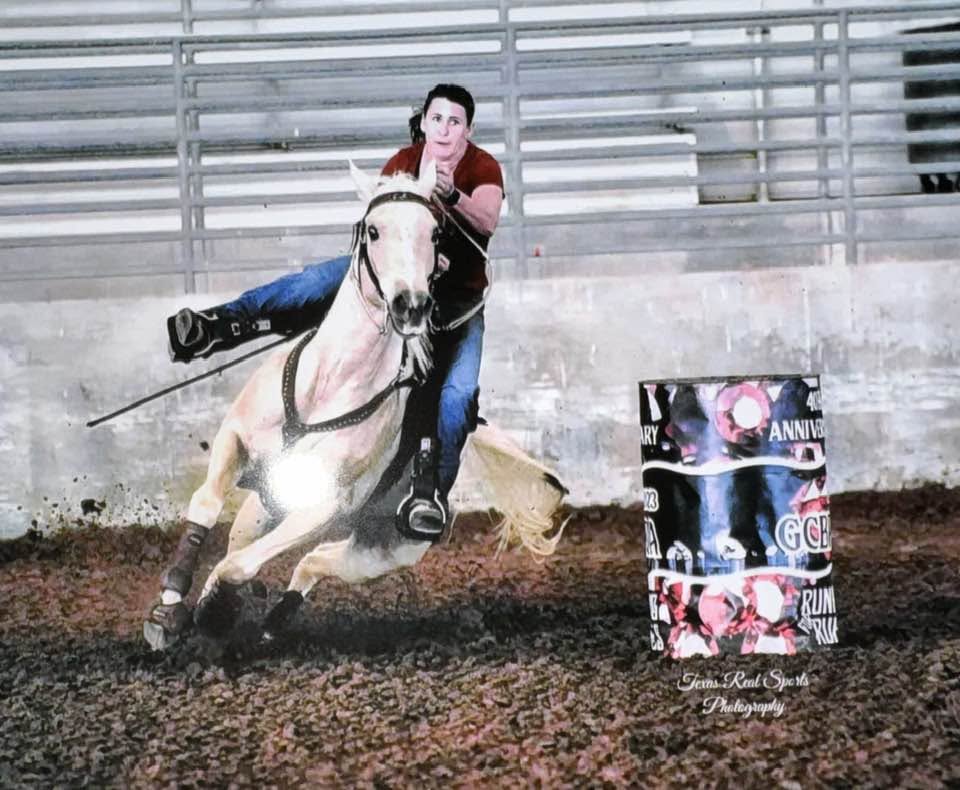 Barrel racing horse and rider